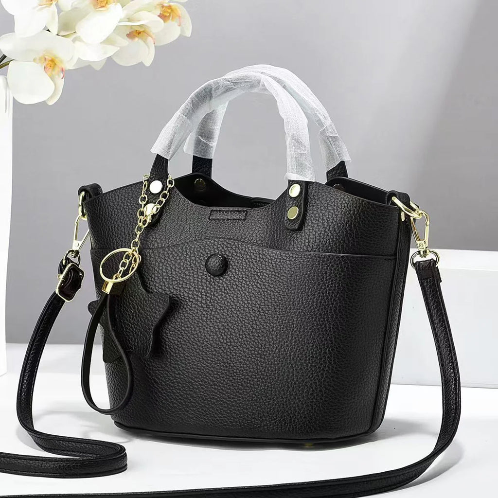 Bolso de mano con detalle de estrella decorativa