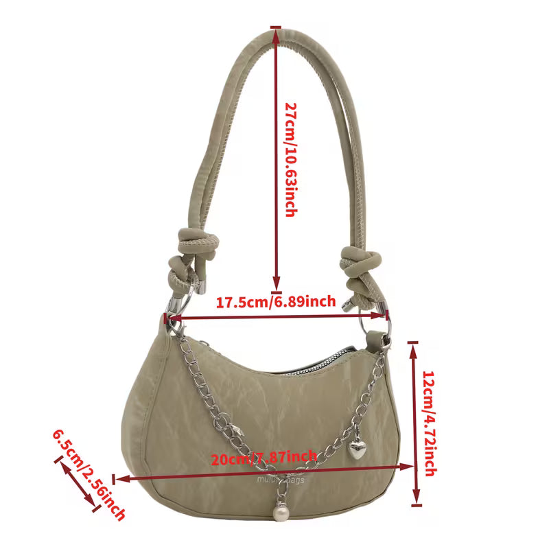Bolso de mano con exquisitos adornos de herrajes