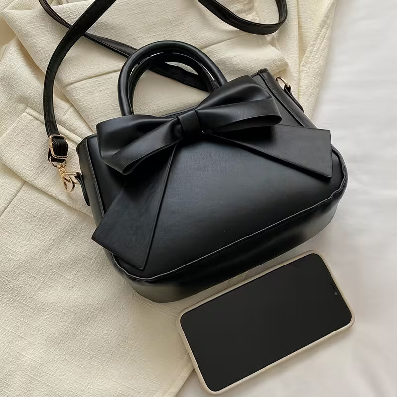 Elegante Bolso de Mano con Lazo Negro, diseño recién agregado